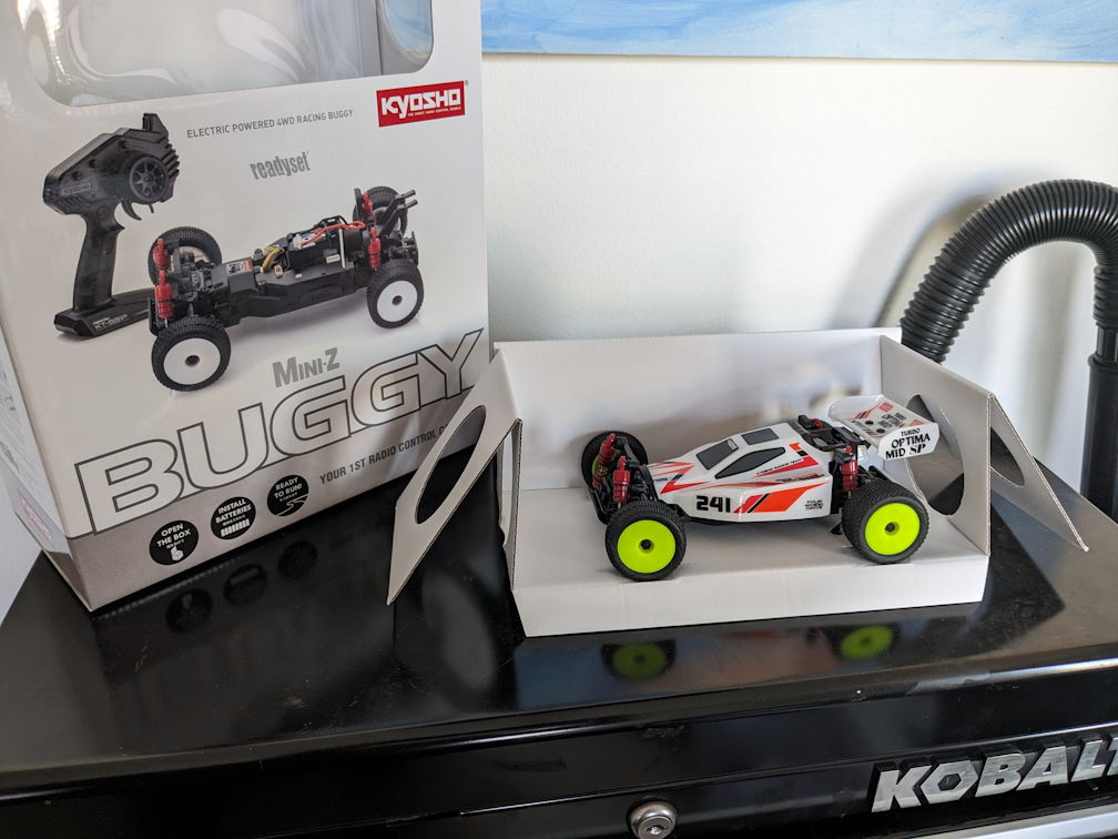 a kyosho mini z buggy in Optima Mid orange and white livery