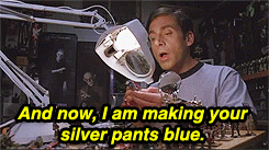 a gif of Andy in The 40-Year-Old Virgin painting a model figure of a polearm soldier with billowy pants saying: and now i am making your silver pants blue